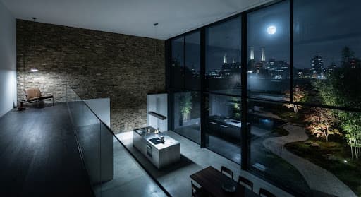 Modern double-height glass kitchen pavilion in a Victorian terraced family residence in Battersea